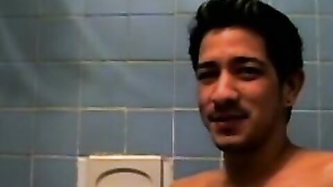 Dirty guy Justin oozed cum after wanking his long hard cock in the bathroom