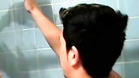 Dirty guy Justin oozed cum after wanking his long hard cock in the bathroom