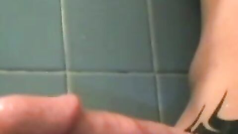 Dirty guy Justin oozed cum after wanking his long hard cock in the bathroom