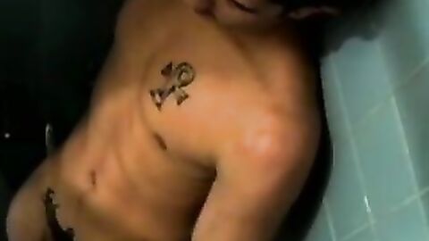 Dirty guy Justin oozed cum after wanking his long hard cock in the bathroom