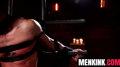 Chris Damned drips wax over Damaged Bttm and cleans it off with flogger
