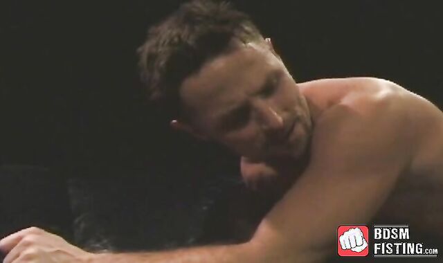 Kinky gay tugs on his cock while being fist fucked hardcore