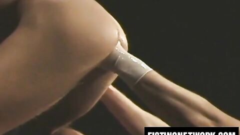 Kinky gay jerks cock while getting fisted raw