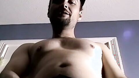 Bearded amateur plays with his dick and cums on himself