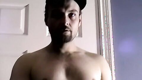 Bearded amateur plays with his dick and cums on himself