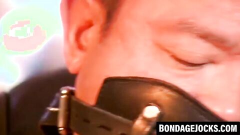 Bound Asian man tormented while struggling to break free