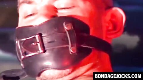 Submissive cop bound on the hood of a car and dominated