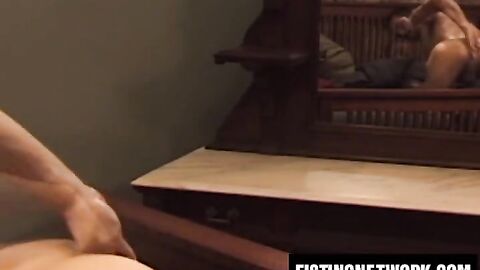 Bearded Tom Vacarro fists and fucks himself with a big dildo