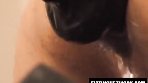 Bearded Tom Vacarro fists and fucks himself with a big dildo