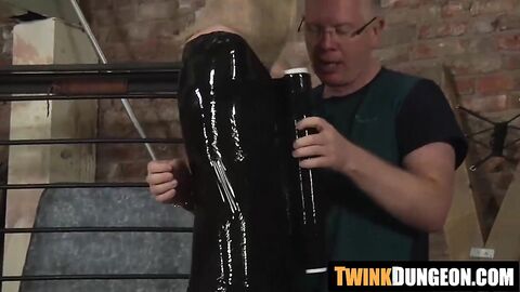 Twink Xavier gets wrapped in plastic by a kink master