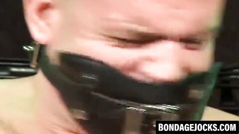 Inked man was tied up and subdued wearing only underwear