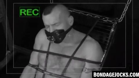 Inked man was tied up and subdued wearing only underwear