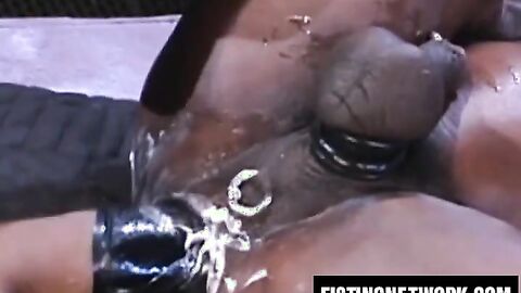 Micahel Brandon slides his arm into Simon Cox's hungry hole