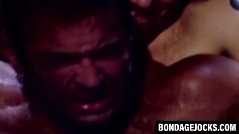 Inked hunk choked and dominated after losing a wrestling match