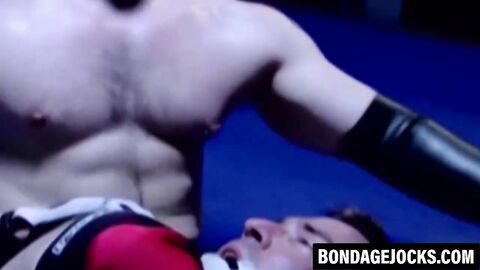 Inked hunk choked and dominated after losing a wrestling match