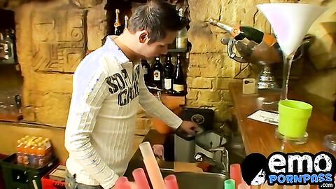 Cute gay guy wanks behind bar until he cums in a glass