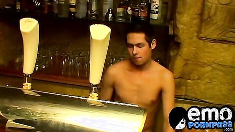 Cute gay guy wanks behind bar until he cums in a glass