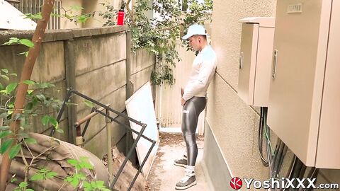 Yoshi Kawasaki jerks his bulge behind the fence and blasts his load