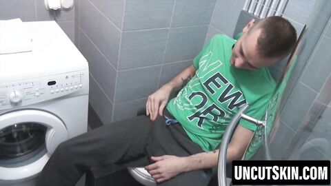 Hot twink masturbates solo in the bathroom with wild strokes