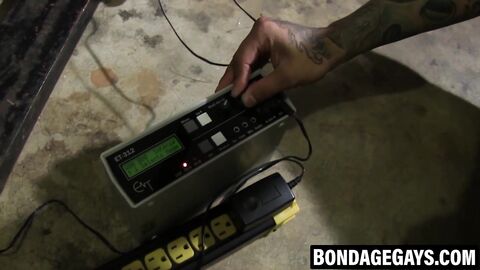 Inked Dom ties stud for painful pleasure session