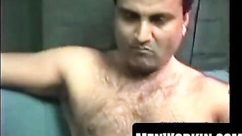 Hairy Shawn strokes his cock hard on the bed