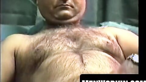 Hairy Shawn strokes his cock hard on the bed