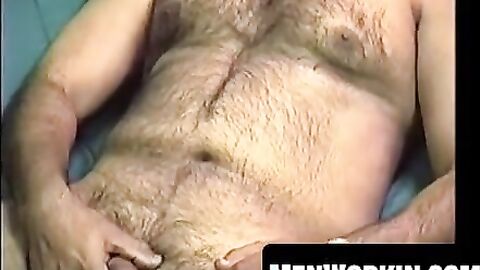 Hairy Shawn strokes his cock hard on the bed