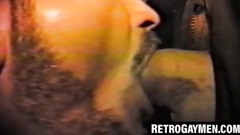 Retro stud throatfucks for cumshot at glory hole