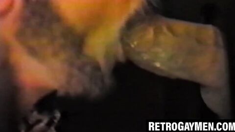 Retro stud throatfucks for cumshot at glory hole