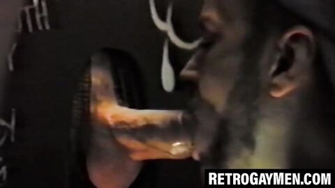 Retro stud throatfucks for cumshot at glory hole