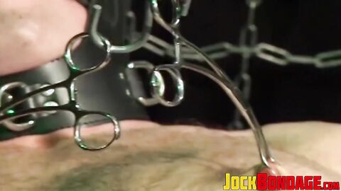 Submissive young man moans as he is gagged and tied up