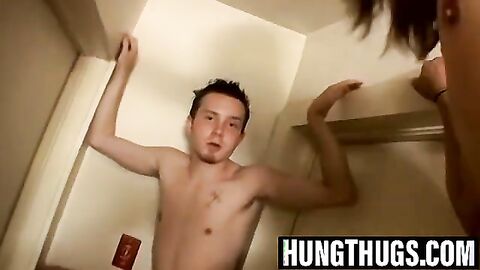 Billy and Damien stroke hard cocks in hallway