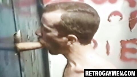 Muscled gays service glory holes with hungry mouths