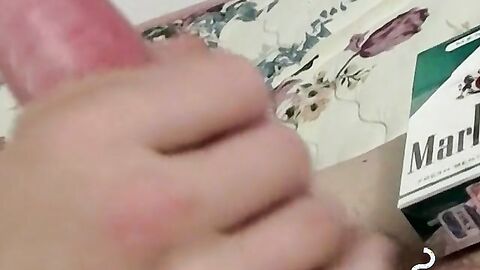 Inked skinny dude plays with himself while smoking