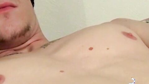 Inked skinny dude plays with himself while smoking