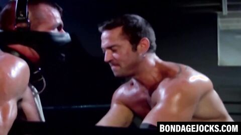Wild wrestler submits to brutal domination in BDSM scene