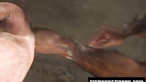 Huessein slides arm in and out of Sean Harris' wide asshole