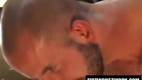 Huessein slides arm in and out of Sean Harris' wide asshole