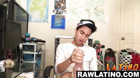 Tattooed Latino twink tugs his fat dick till eruption