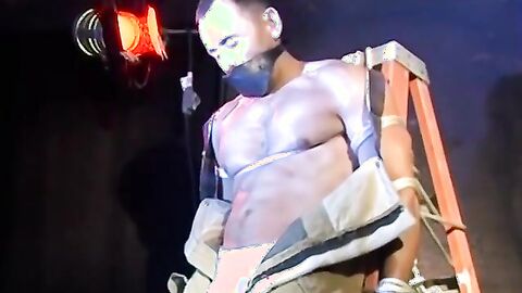 Muscular man bound tight waiting for torment from the captor