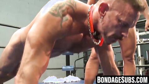 Dominant gay restrains partner up for rough erotic torment