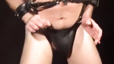 Bigg Pete struggles against chains tied down to his balls