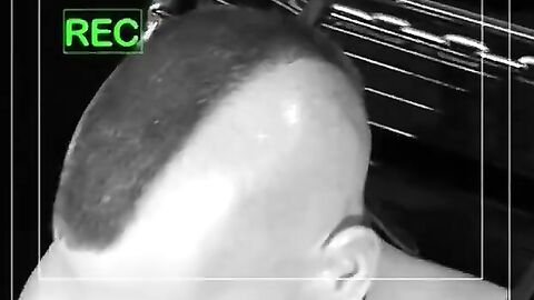 Bigg Pete roped down in chains with his mouth strapped shut