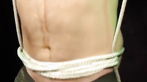 Bigg Pete hands bound and balls roped down to his toes