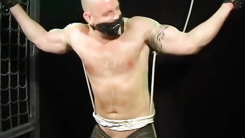 Bigg Pete hands bound and balls roped down to his toes