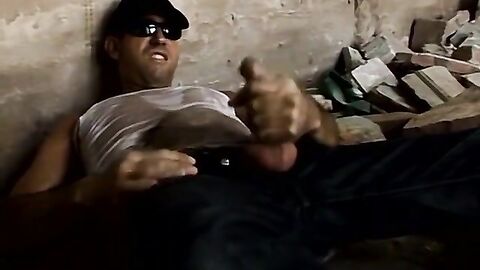 Big dick stud jacks off while pissing on himself