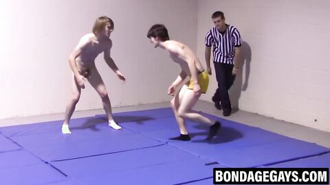 Slim gays spar intensely while stripping naked with hard cocks