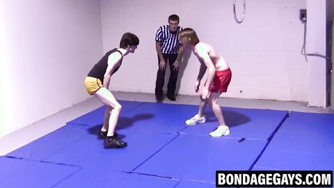 Slim gays spar intensely while stripping naked with hard cocks