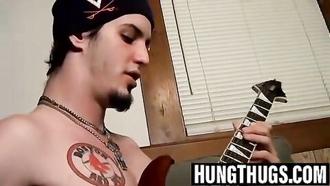 Straight Axel strums the guitar while jerking off