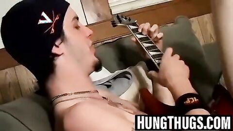 Straight Axel strums the guitar while jerking off